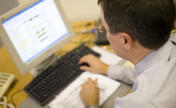 bigstockphoto_Man_Working_Computer_220418