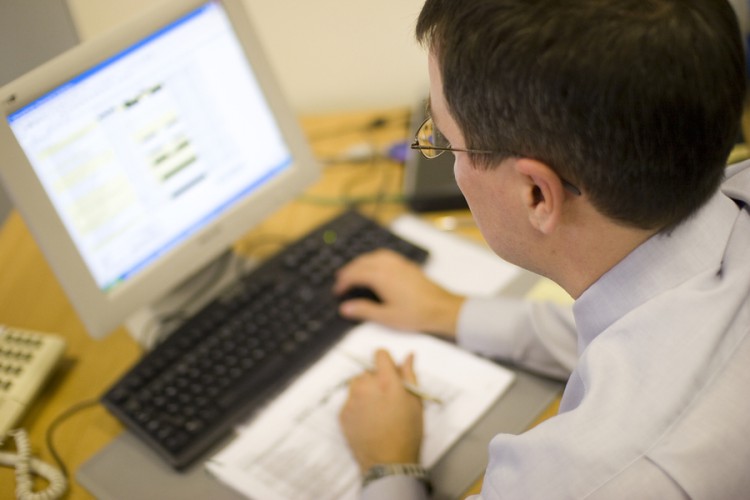 bigstockphoto_Man_Working_Computer_220418